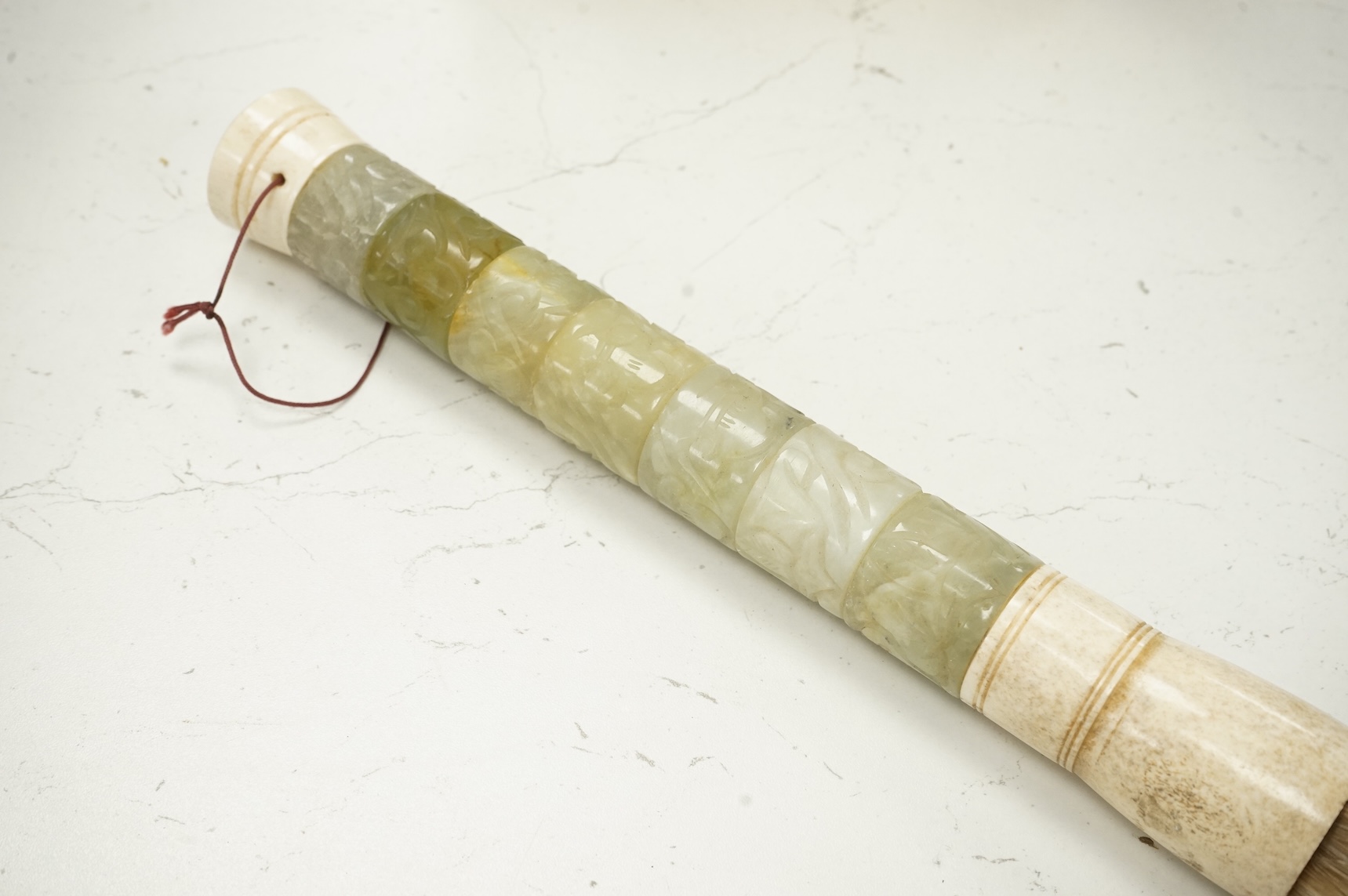 A carved jadeite and bone fly whisk, 39cm long